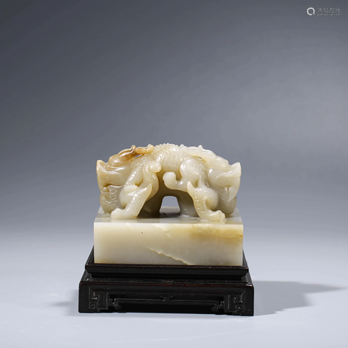 A CHINESE DRAGON SEAL & STAND