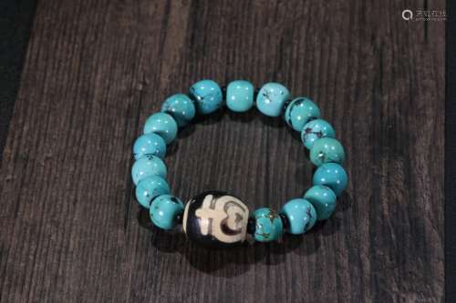 A Turquoise Stone Bracelet With Dzi