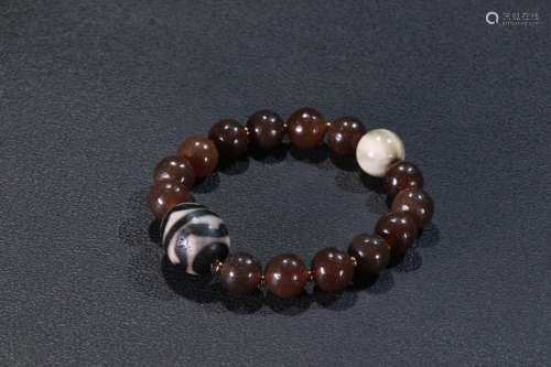 An Agate Bracelet With Dzi