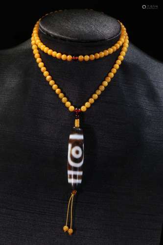An Amber Necklace With Two-Eye Dzi