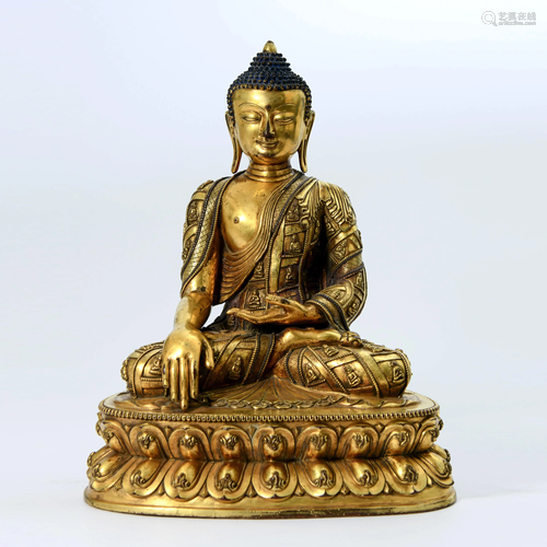 A CHINESE GILT-BRONZE SAKYAMUNI STATUE