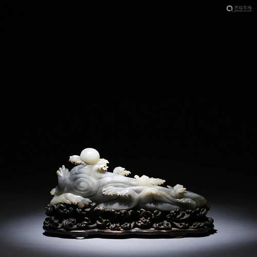 A CHINESE JADE CARVING & STAND