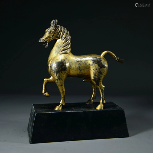 A CHINESE GILT-BRONZE HORSE