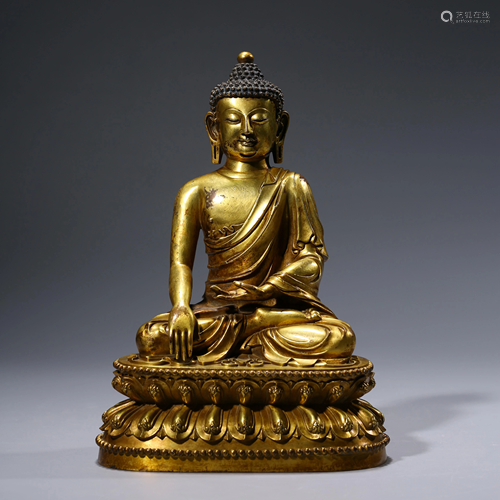 A CHINESE GILT-BRONZE SAKYAMUNI STATUE MARKED MING …