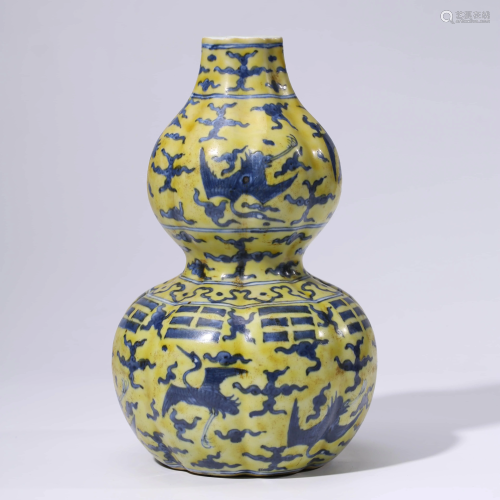 A CHINESE YELLOW-GROUND PORCELAIN FLYING BEASTS