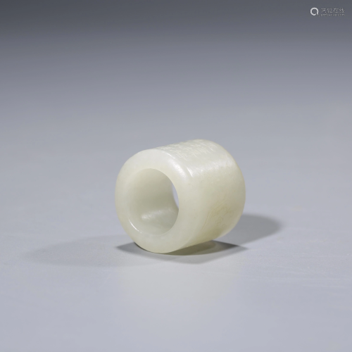 A CHINESE WHITE JADE RING MARKED QIAN LONG