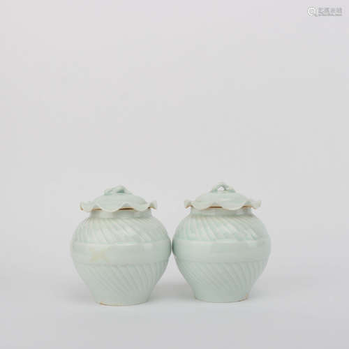 A Pair of Light Green Glazed Porcelain Jars and Cover