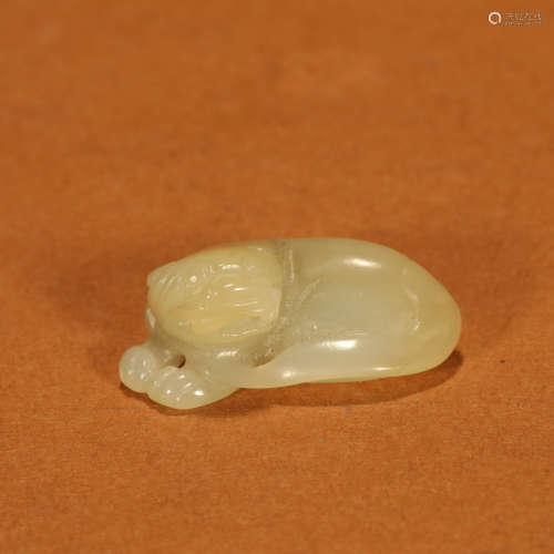 A Hetian Jade Carved Lion Pendant