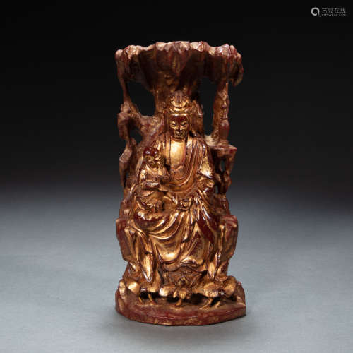 AN  CHINESE LACQUERED WOOD CARVED GUANYIN