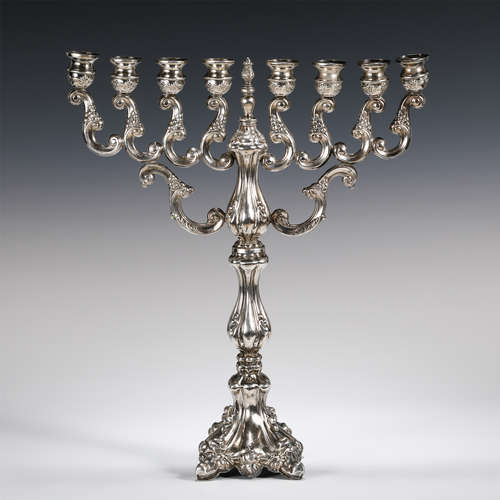 A SILVERWARE CANDLESTICK