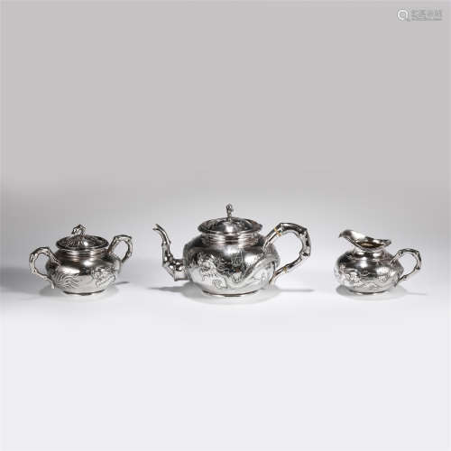 A SET OF CHINESE THREE EXPORT SILVERWARE TEA SETS