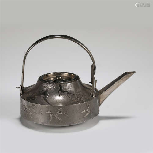 A JAPANESE TIN WARE LONG HANDLE KETTLE