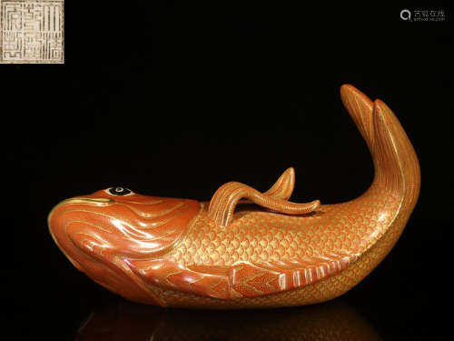 RED GROUND AND GILT 'FISH' FIGURE