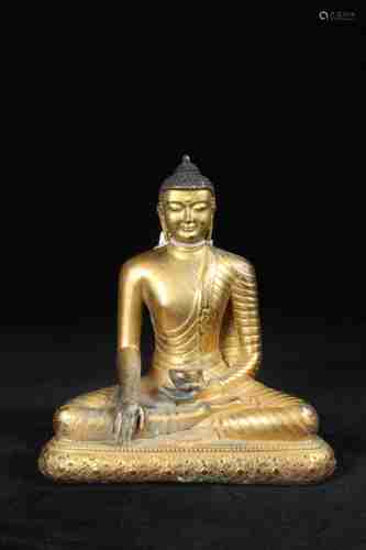 A CHINESE GILT BRONZE SAKYAMUNI STATUE IN THE 17TH CENTURY