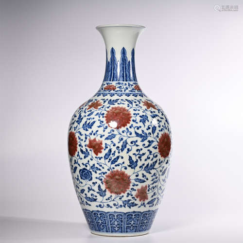 Qing Dynasty Qianlong blue and white glaze red wrapped branches lotus bottle