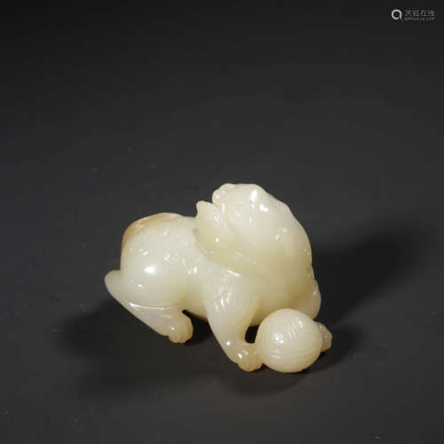 A White Jade Carved Lion Ornament