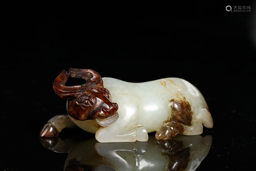 A CHINESE VINTAGE HETIAN JADE BULL FIGURINE