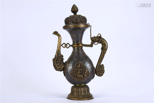 A GILT SILVER KETTLE WITH HANDLE