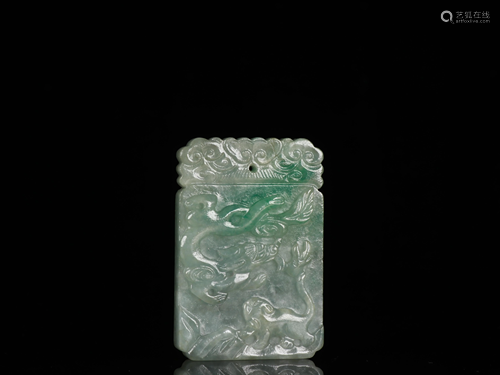 A FINELY CARVED JADEIET PENDANT