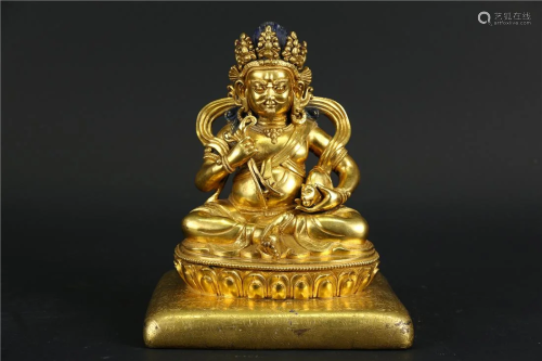 A GILT BRONZE STATUE