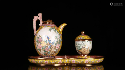 A SET OF ENAMEL TEAPOTS