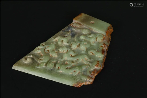 AN AXE HEAD MADE OF HETIAN JADE