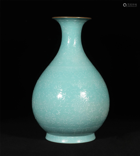 A GREEN GLAZED VASE