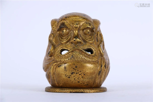 A BRONZE HEAD SHAPE INCENSE BURNER