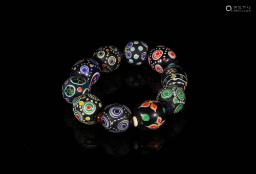 A BRACELET MADE OF OLD GLASS BEADS