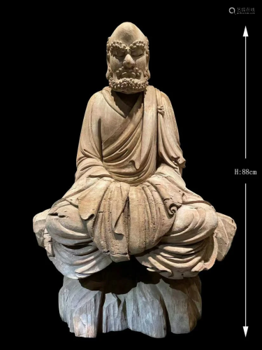 A WOODEN STATUE OF DHARMA