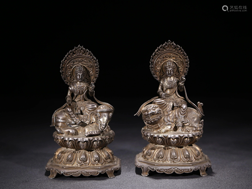 A PAIR OF SILVER BUDDHA STATUES