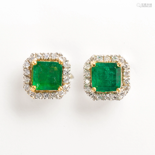 A pair of emerald, diamond and eighteen karat white