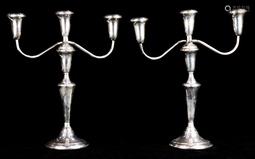 A pair of Gumps sterling weighted three light