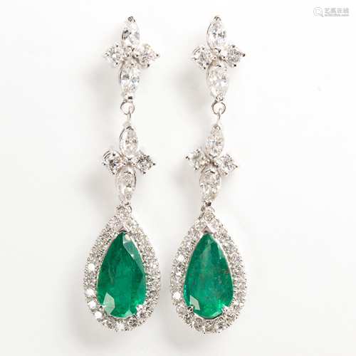 A pair of emerald, diamond and eighteen karat white