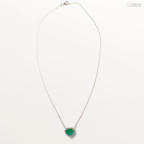 An emerald, diamond and eighteen karat white gold