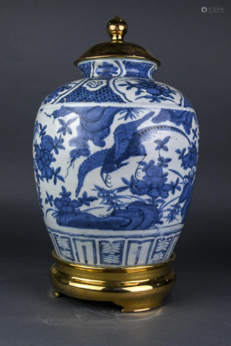 A Chinese Ming style blue and white jar with brass lid