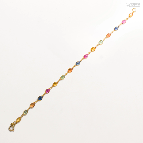 A sapphire, ruby and eighteen karat gold bracelet