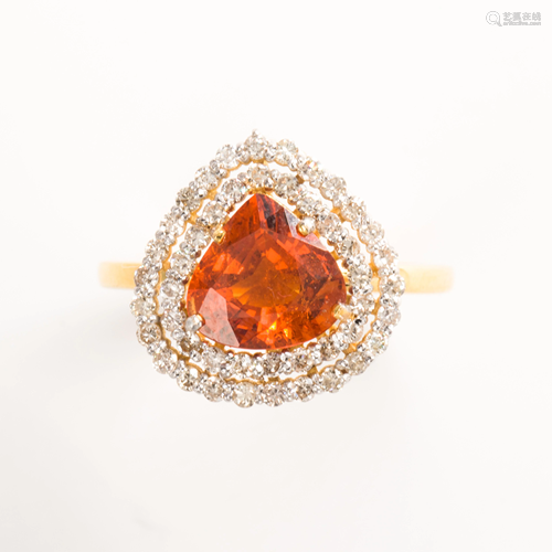 A spessartine garnet, diamond and eighteen karat gold