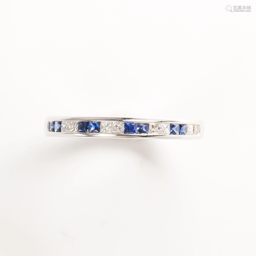 A sapphire, diamond and eighteen karat gold band ring