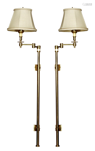 A pair of adjustable brass wall lamps