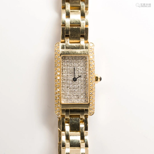 A fourteen karat gold and diamond dress wristwatch