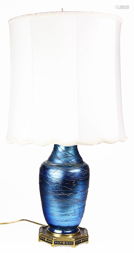 An iridescent art glass vase mounted as a lamp