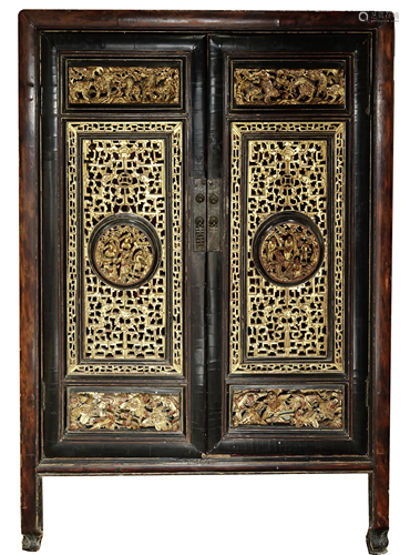 A Chinese lacquered and gilt wood tea cabinet