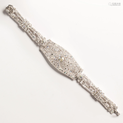 An Art Deco diamond and platinum strap bracelet