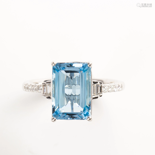 An aquamarine and platinum ring