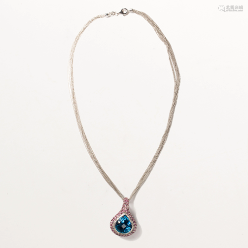 A blue topaz, pink tourmaline and eighteen karat white