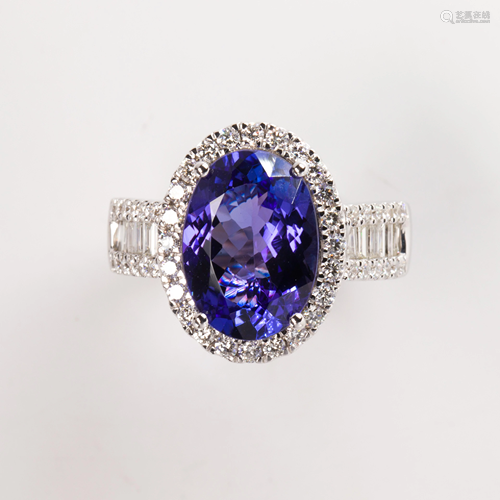 A tanzanite, diamond and fourteen karat white gold ring