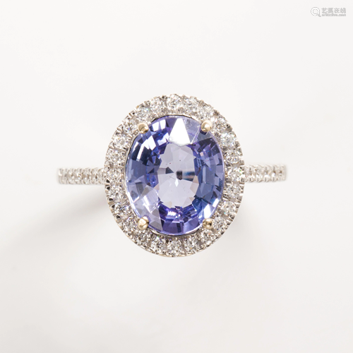 A tanzanite, diamond and eighteen karat white gold ring