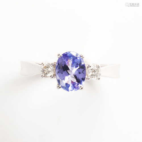 A tanzanite, diamond and fourteen karat white gold ring