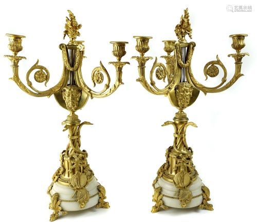 A pair of Rococo style gilt bronze candelabras